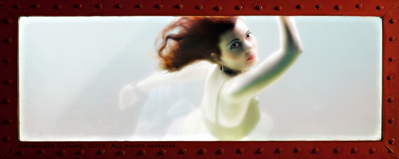 A redheaded mermaid looks out the window of her tank of glowing water.