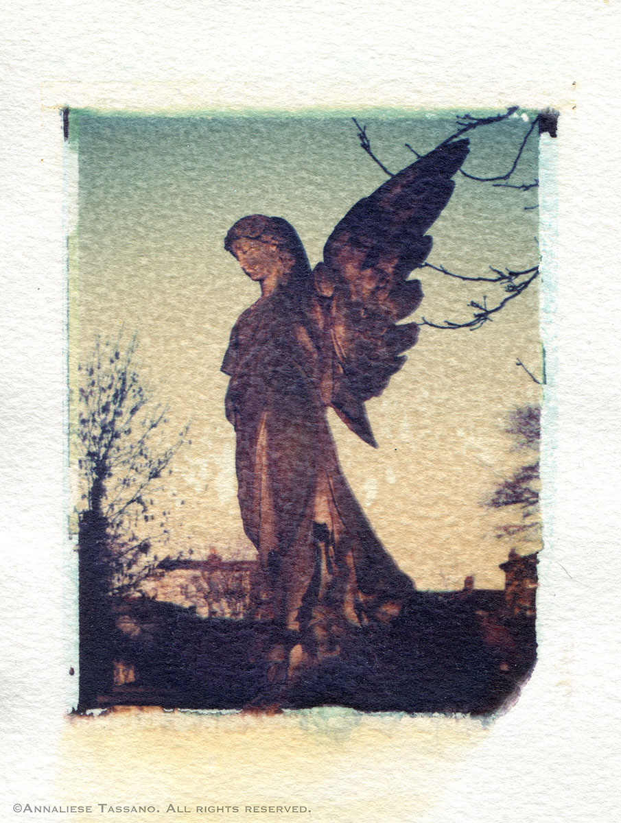 A stone cemetery angel in Kensall Green Cemetery. Polaroid transfer.