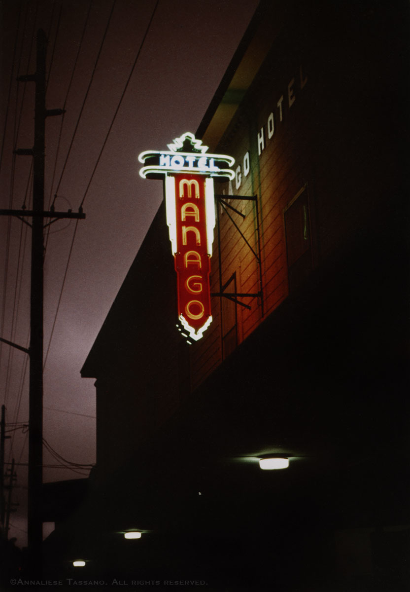 A night view of the vintage neon sign for the old Manago Hotel in Captain Cook, Big Island, Hawaii.