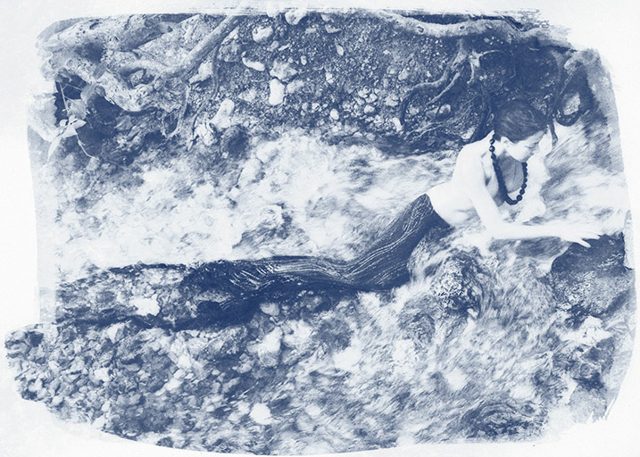 An adventurous mermaids ventures of the rapids of a creek.